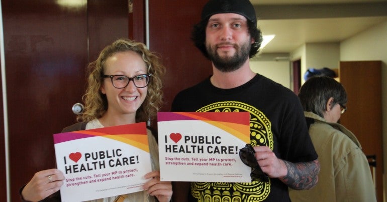 CUPE members holding "I <3 Public Health Care" signs