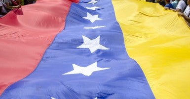 Venezuelan flag and people