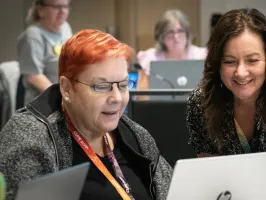 CUPE members at a laptop